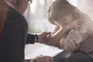 a counselor comforts a woman in cocaine addiction treatment san diego offers